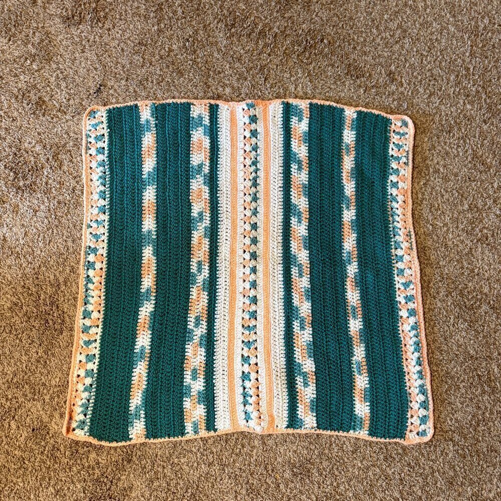 Handmade teal and orange gender neutral knitted baby blanket